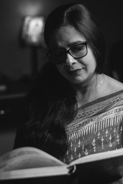 Black and White Portrait of Woman Reading Book
