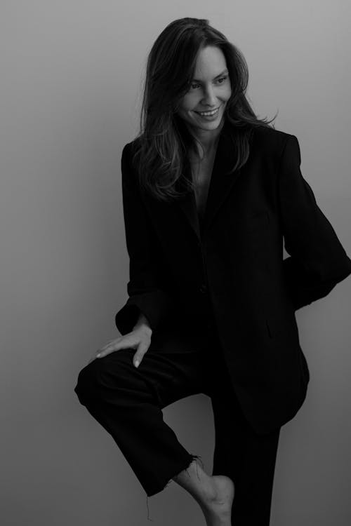 Smiling Woman in Black Suit