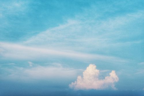 Free Aerial view of a clear blue sky with fluffy white clouds, captured over Hanoi, Vietnam. Stock Photo