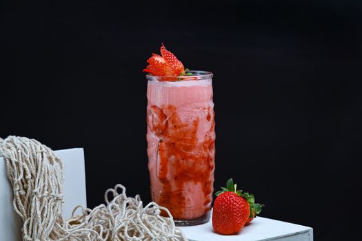 Delicious strawberry smoothie served in a tall glass, perfect for a refreshing summer drink.