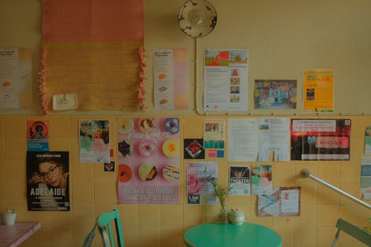Vibrant posters on a café wall in Bonn, Germany create a colorful and cozy ambiance.