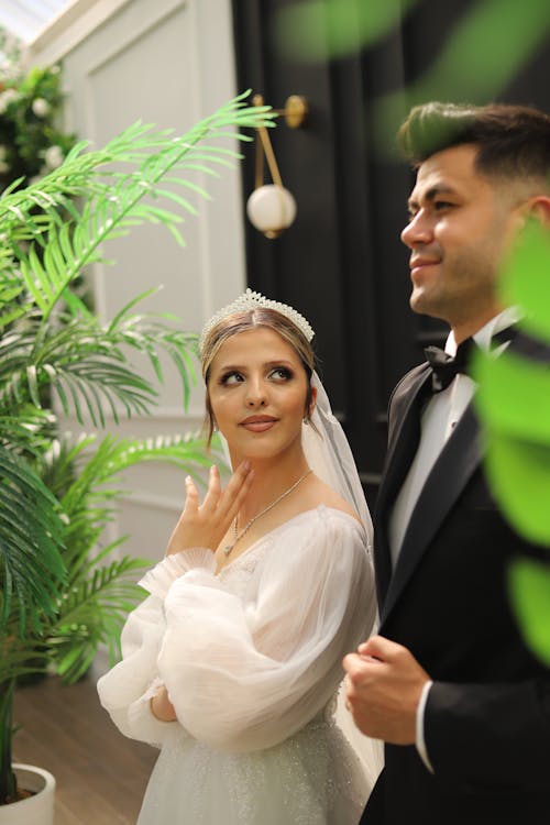 Bride and Groom Posing at a Garden Pavilion