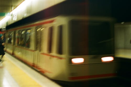 Film Photo of a Moving Train at a Subway Station 