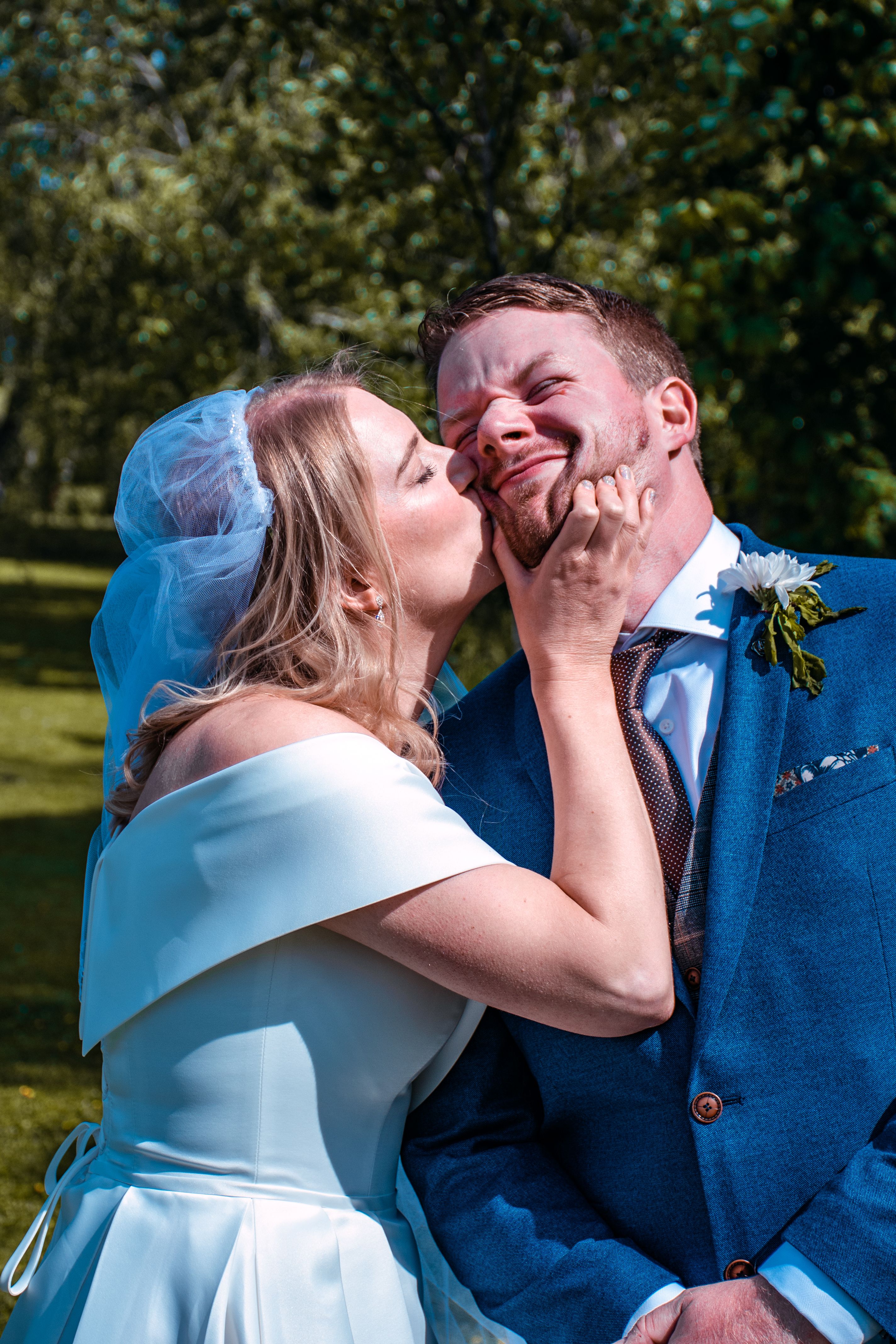 Bride Kissing Groom in Cheek · Free Stock Photo