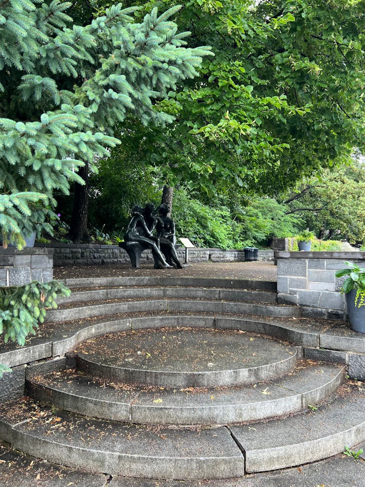 Trees Over Sculpture In Park