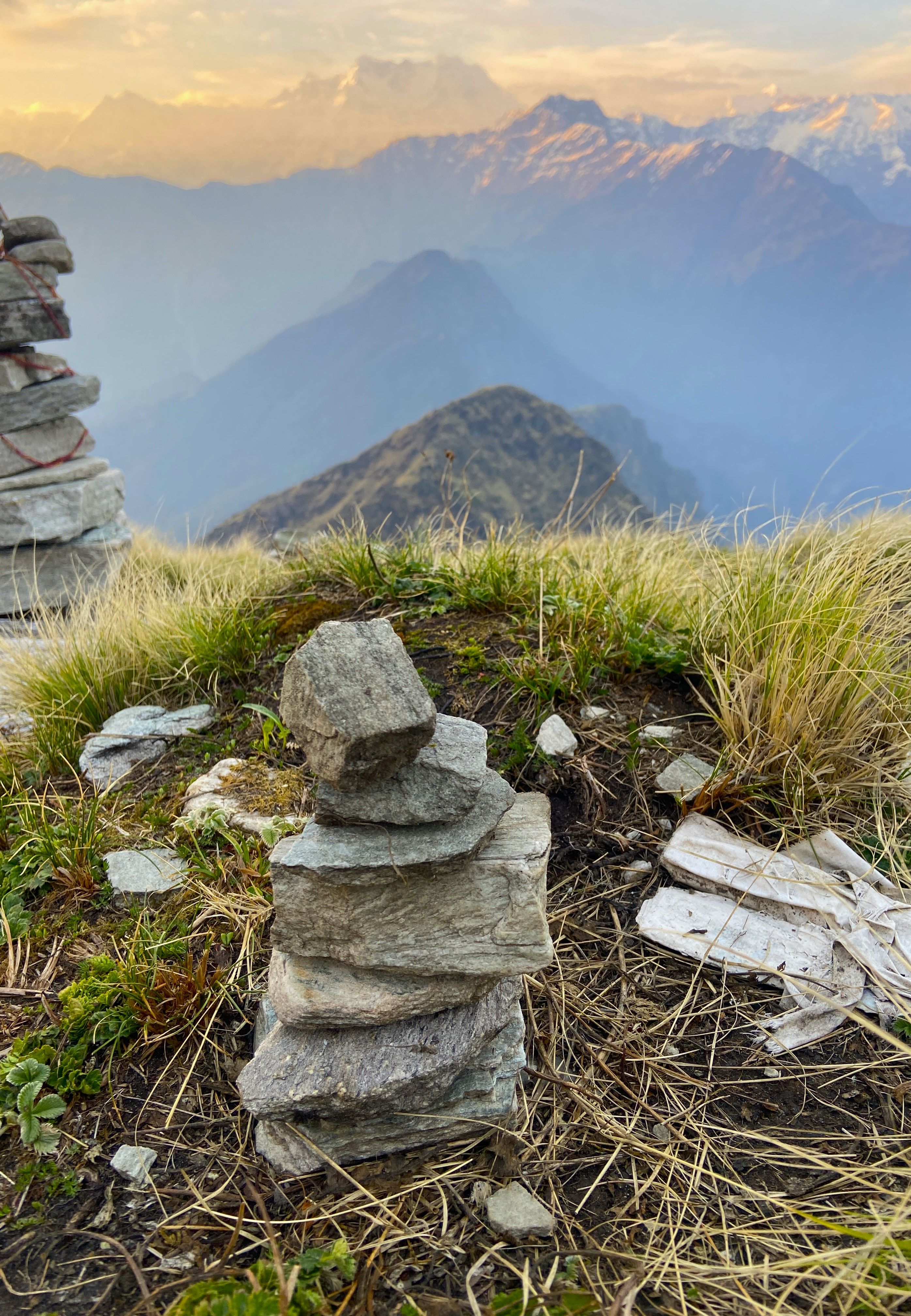 Stack of Stones in Grass on the edge of a Mountain Gorge · Free Stock Photo