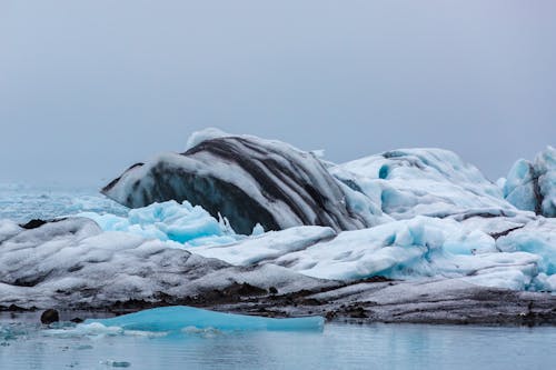 Iceberg of Blue Ice Mixed with Earth