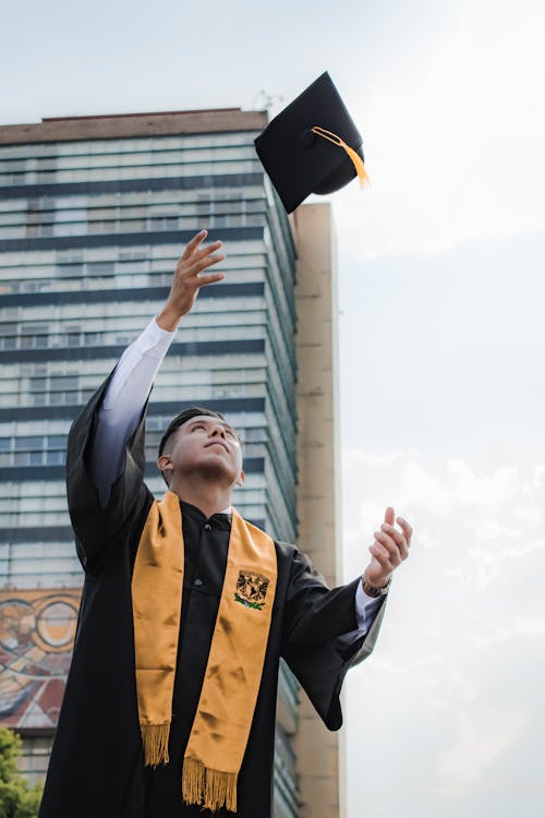 Graduate Throwing Up Academic Hat