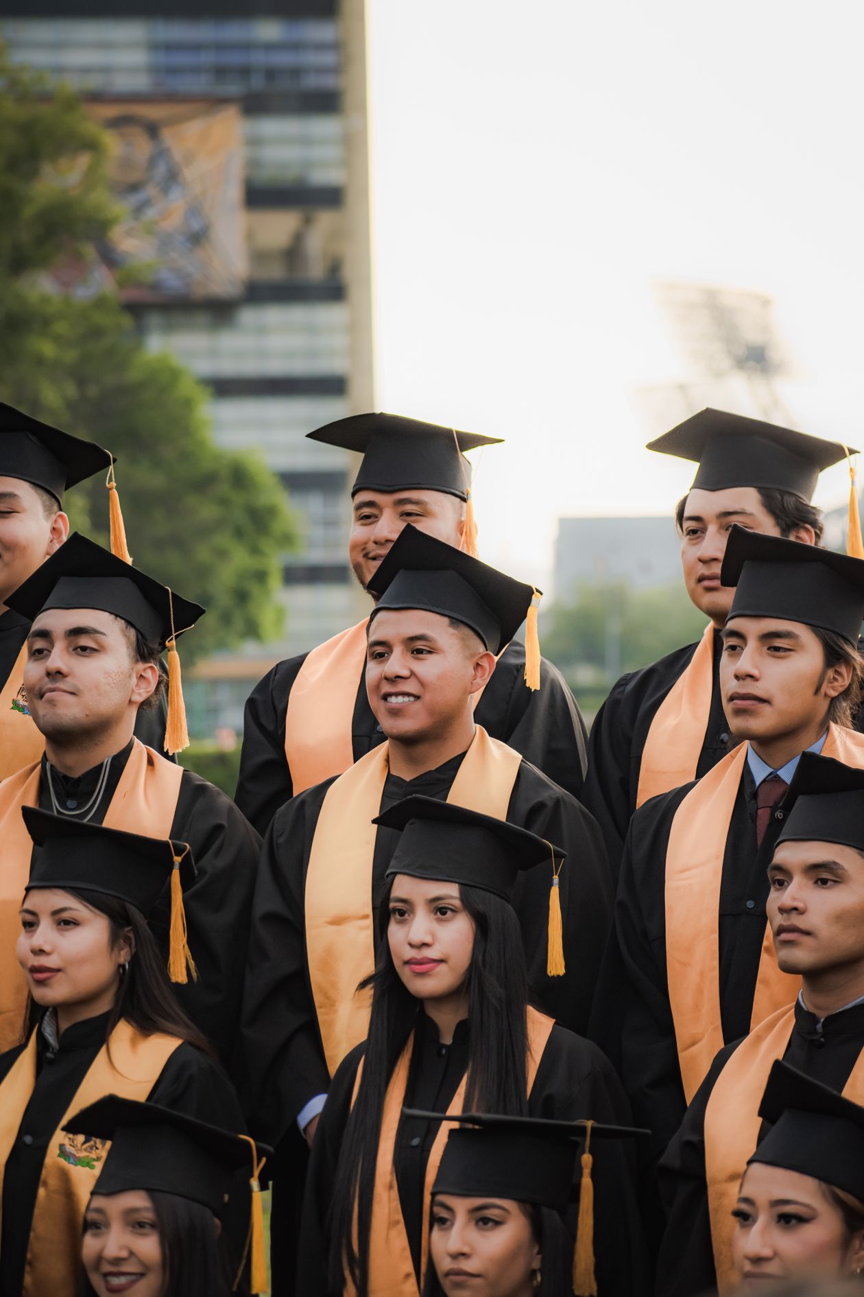 A diverse group of high school graduates celebrating together