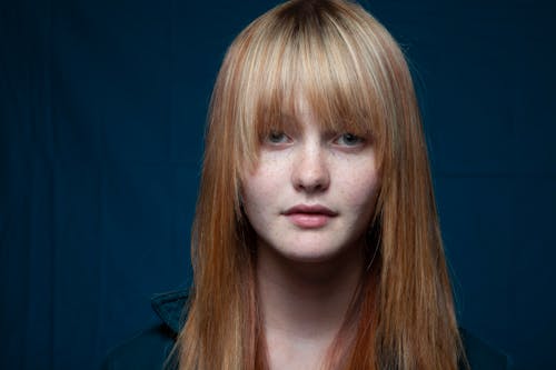 Studio Shot of a Young Girl with Blonde Hair and Bangs 