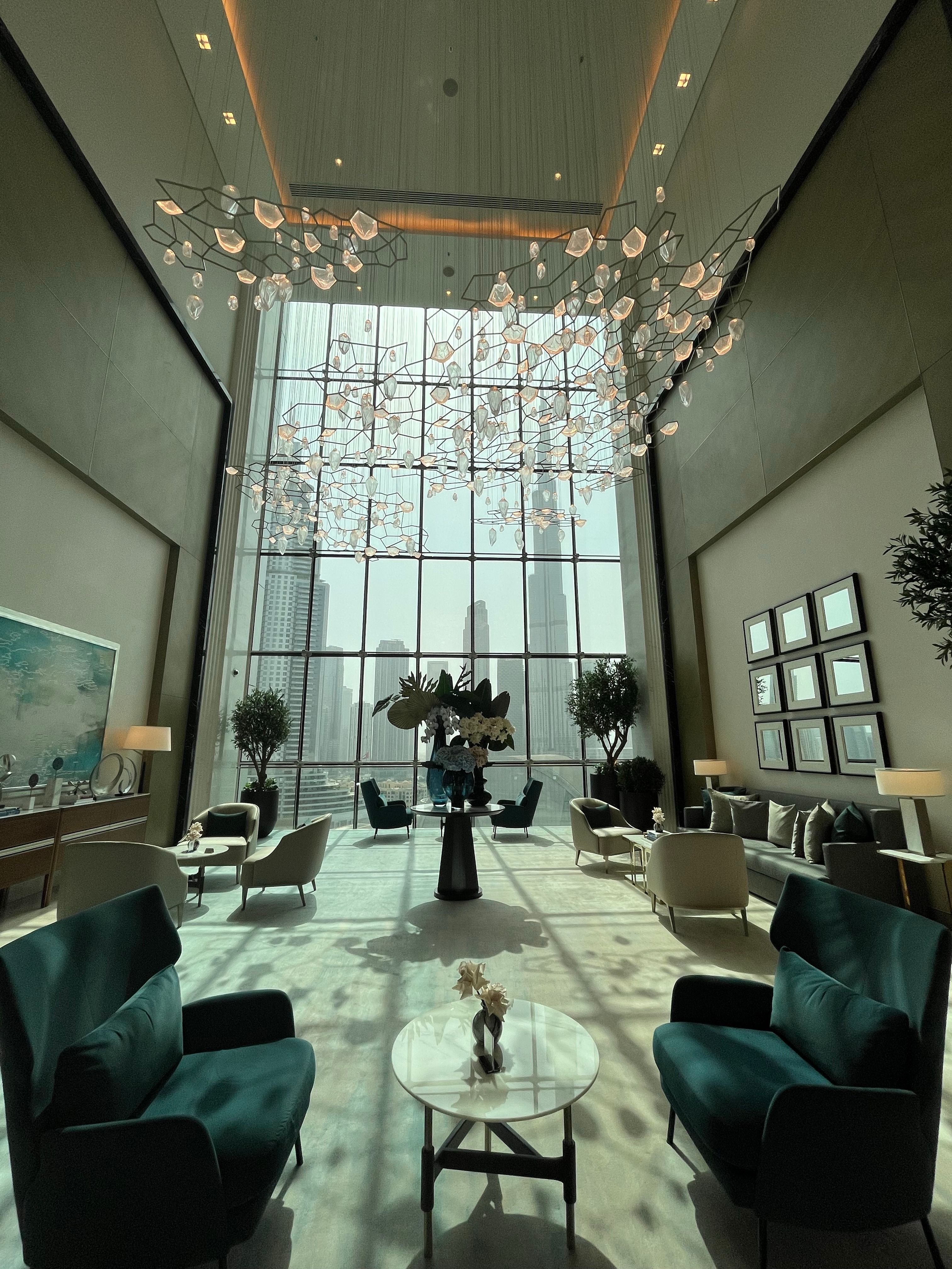 Contemporary Dubai apartment interior with large windows and skyline views