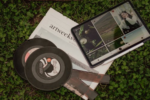 Pictures on Tablet on Ground with Disks and Photographic Films