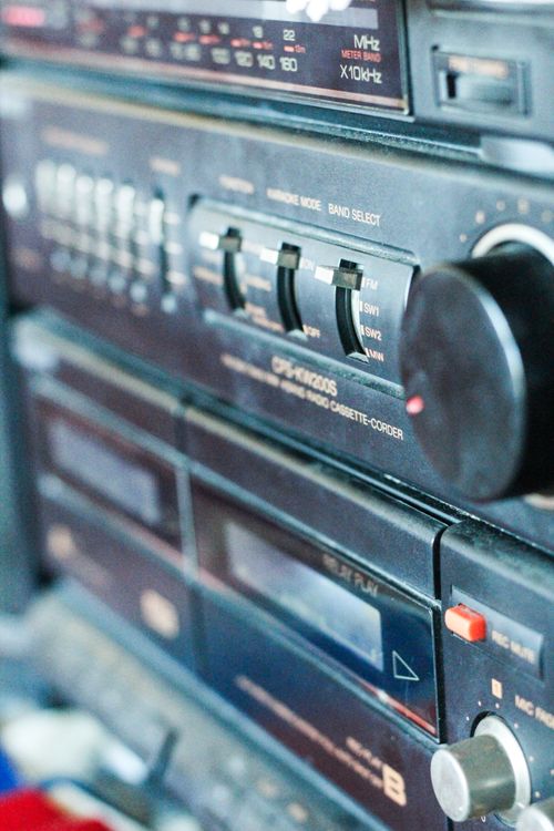 Free Detailed view of a retro tape recorder showcasing its dials and buttons in a vertical shot. Stock Photo
