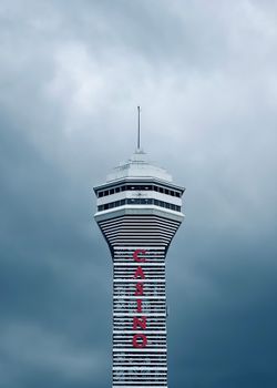 Casino Niagara tower under ominous clouds, highlighting urban architecture in overcast weather.