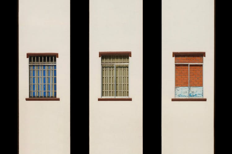 Windows On White Building Wall