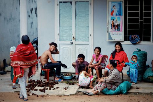A vibrant family gathering outdoors, sharing smiles and laughter in an urban setting.