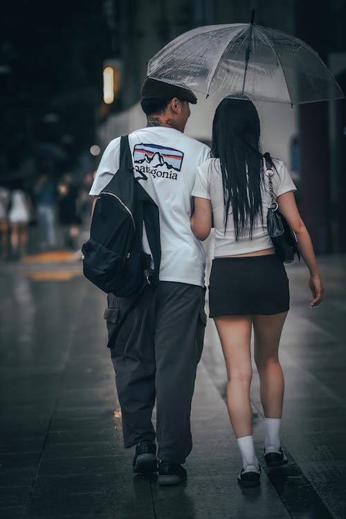 Couple Walking on a Street in Rain