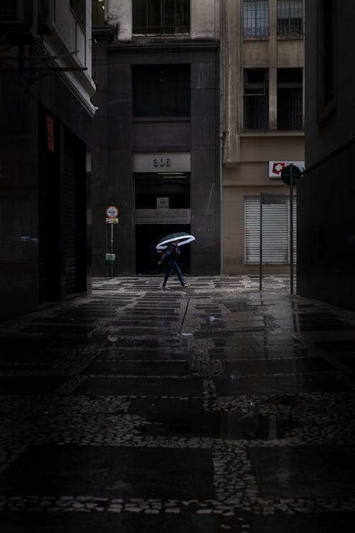 Free Photo of Person Walking in Alley Stock Photo