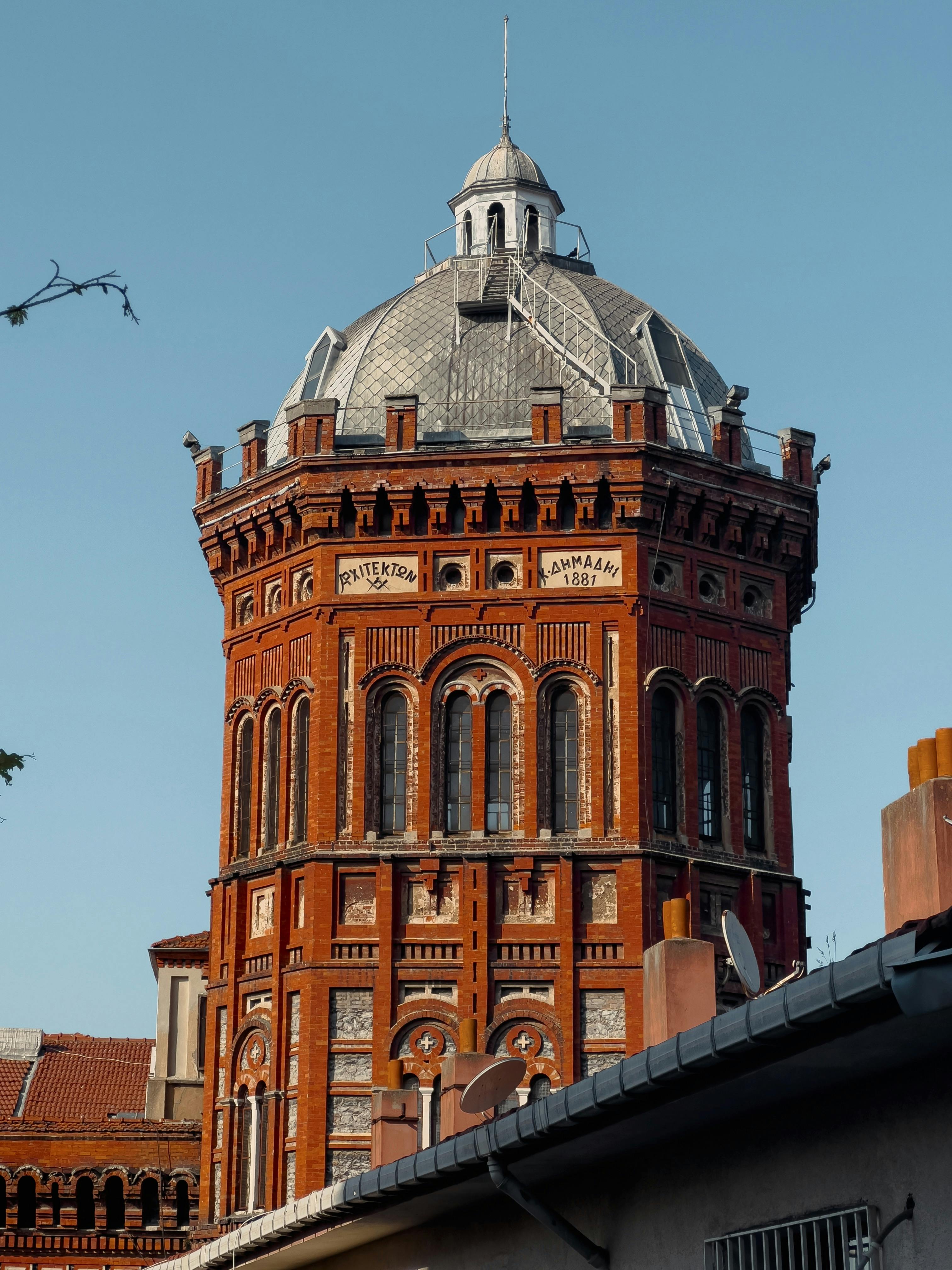 View of the historic Phanar Greek Orthodox College in Istanbul against a clear blue sky.