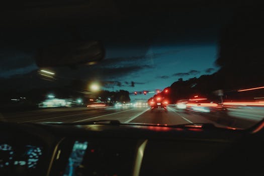 Experience a dynamic night drive through Atlanta with vibrant light trails and city ambiance.