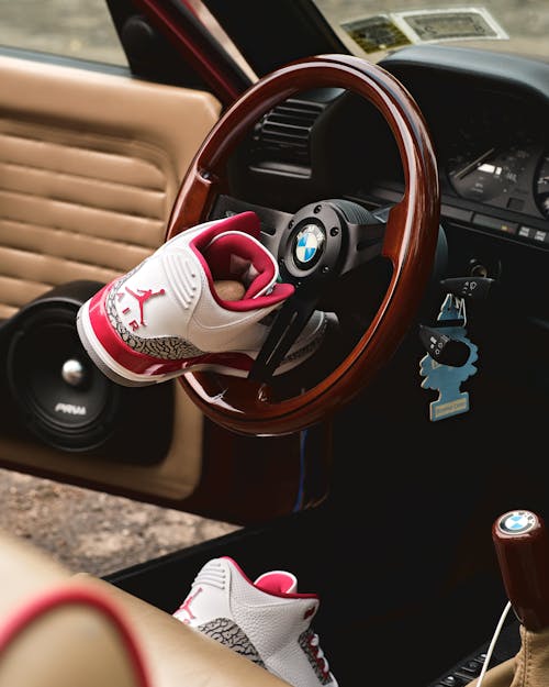 Shoes on a Steering Wheel