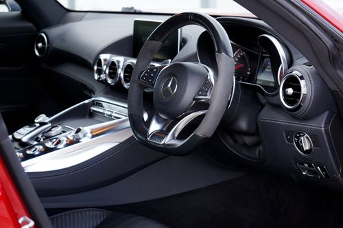 Free High-quality interior of a Mercedes Benz GT with detailed dashboard and steering wheel view. Stock Photo