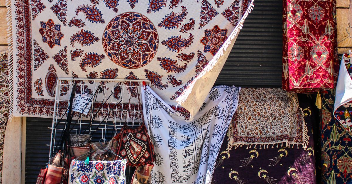 Market Rug Rugs with Traditional Patterns on a Market Stall · Free Stock Photo