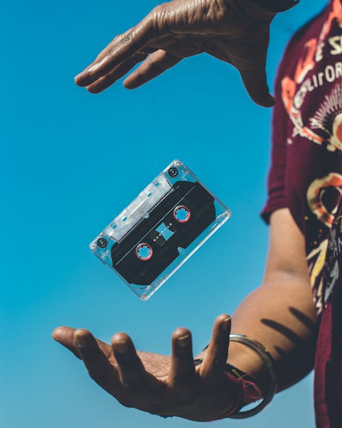 Free Person Doing Tricks on Cassette Tape Stock Photo