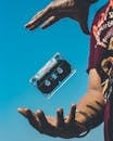 Person Doing Tricks on Cassette Tape