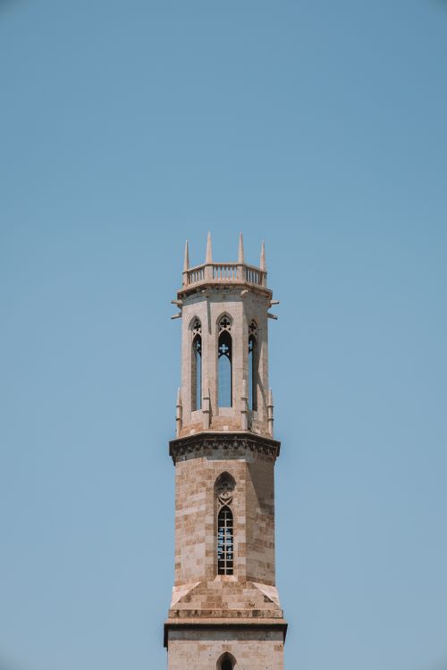 Free Captivating view of a historic tower in Valencia, Spain against a clear blue sky. Stock Photo