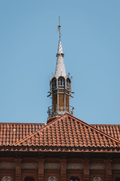 Free A detailed view of a Gothic architectural tower in Valencia, Spain, under a clear sky. Stock Photo