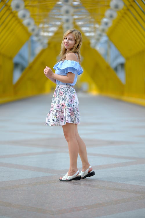 Model in Blue Blouse and Floral Skirt
