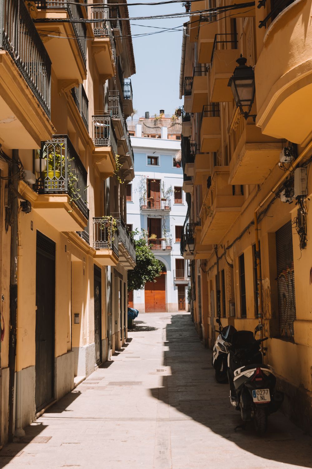 A Narrow Alley between Traditional Buildings in City · Free Stock Photo
