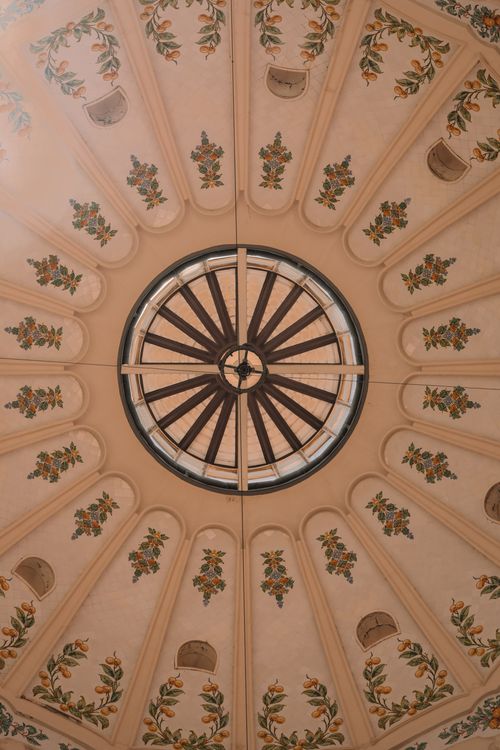 Free A beautifully decorated ceiling with floral patterns in a historic building in Valencia, Spain. Stock Photo