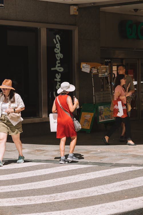 Free Candid Picture of People Crossing the Street in City  Stock Photo