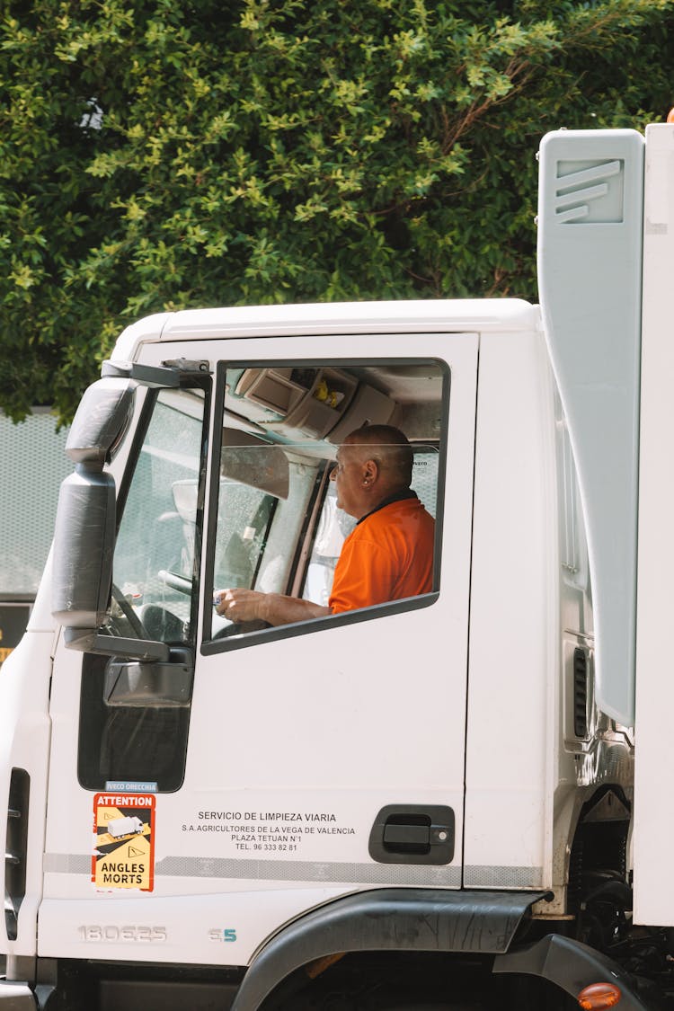 A Man Driving A Truck 