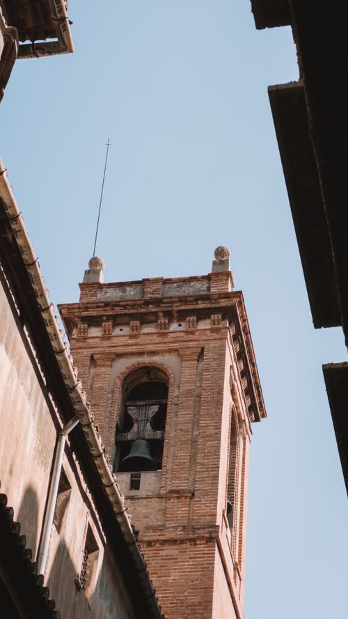 Free A stunning view of a bell tower in Valencia under a clear blue sky. Stock Photo