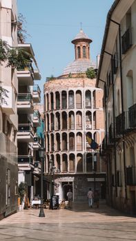 Captivating view of the iconic Torre de Valencia in a charming Spanish alleyway, Valencia, Spain.