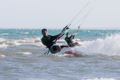 Free Exciting windsurfing scene in Adicora, Venezuela capturing the thrill of water sports under a sunny sky. Stock Photo