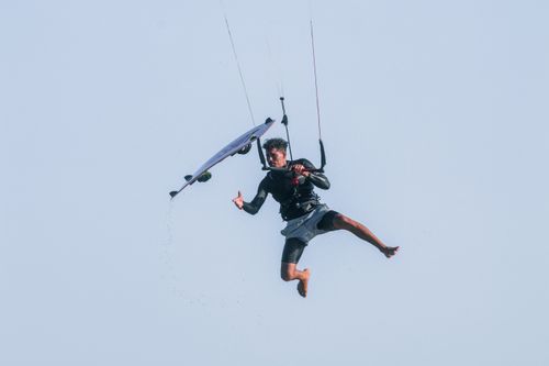 Free A thrilling kiteboarding jump captured in Adicora, Venezuela, showcasing extreme sports action. Stock Photo