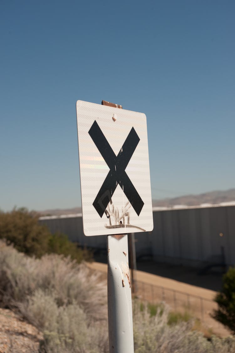 Black X Sign On Board