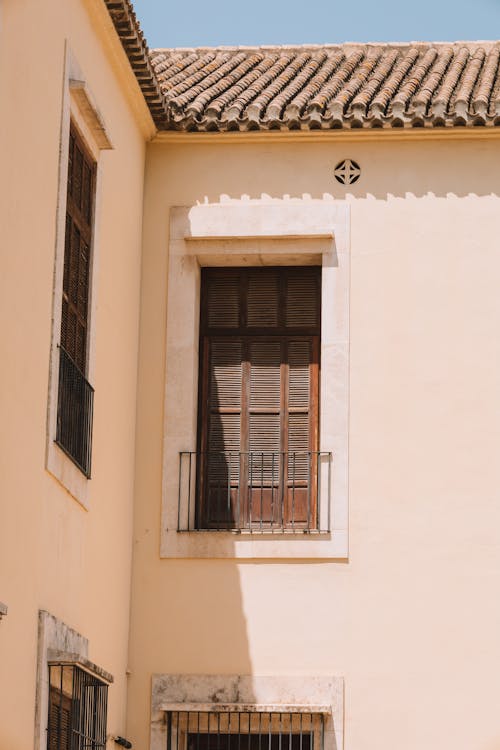 Sunlit Building Wall with Windows