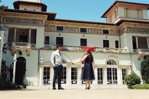 Dancing Couple in Front of a Traditional Building