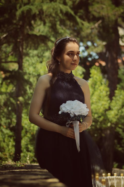 Woman in Black Dress with Bouquet
