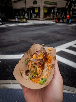 Savor this bacon-wrapped jalapeño popper on a bustling Troy street corner.