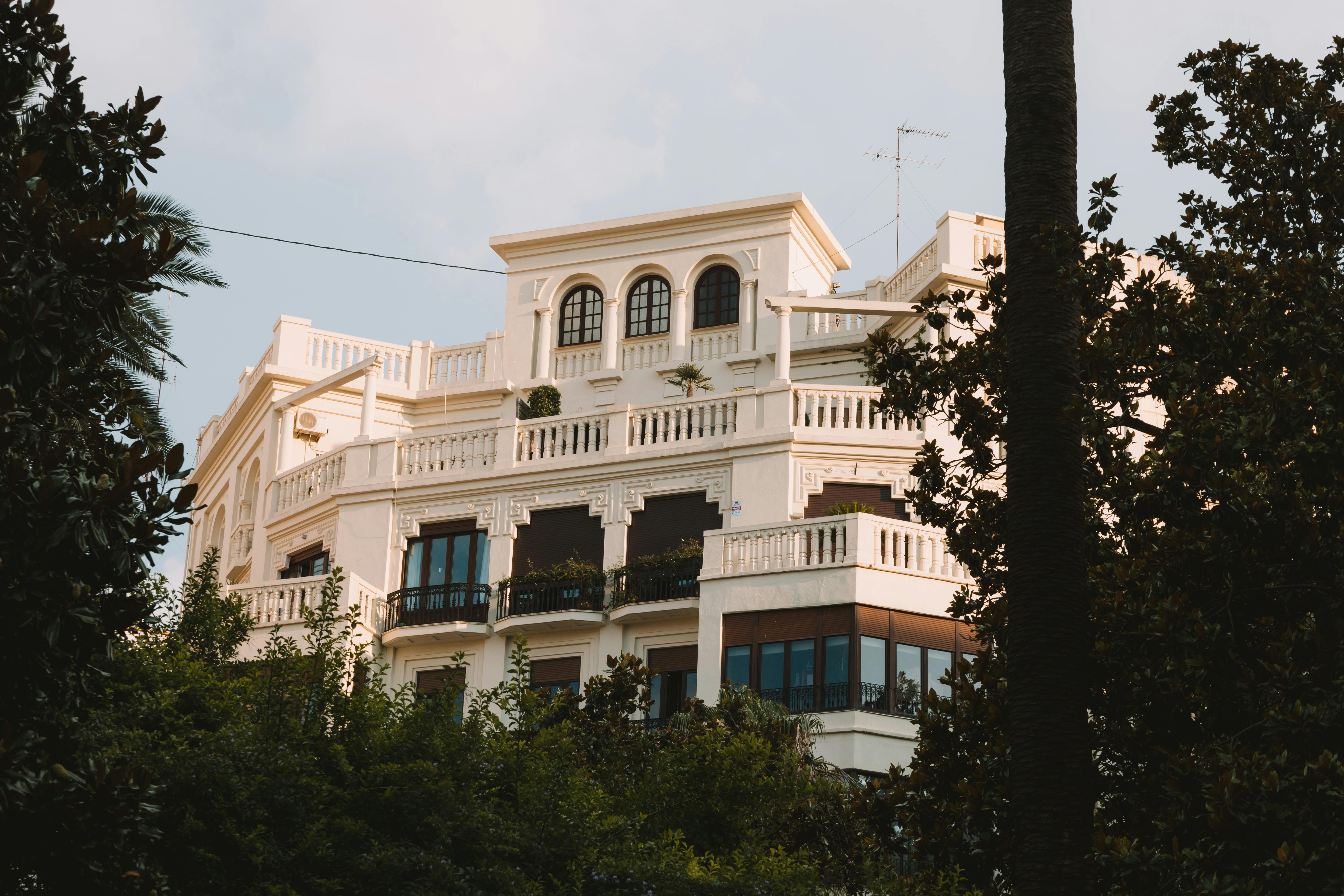 A stunning villa in Valencia, Spain, surrounded by greenery and showcasing classic architecture.