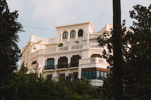 A stunning villa in Valencia, Spain, surrounded by greenery and showcasing classic architecture.