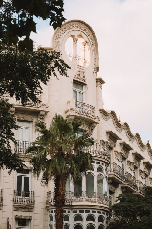Free Stunning view of a historic building facade with palm trees in Valencia, Spain. Stock Photo