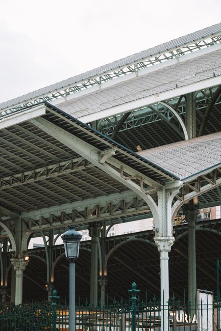 Detailed view of a historic railway station roof in Valencia, Spain showcasing architectural beauty.