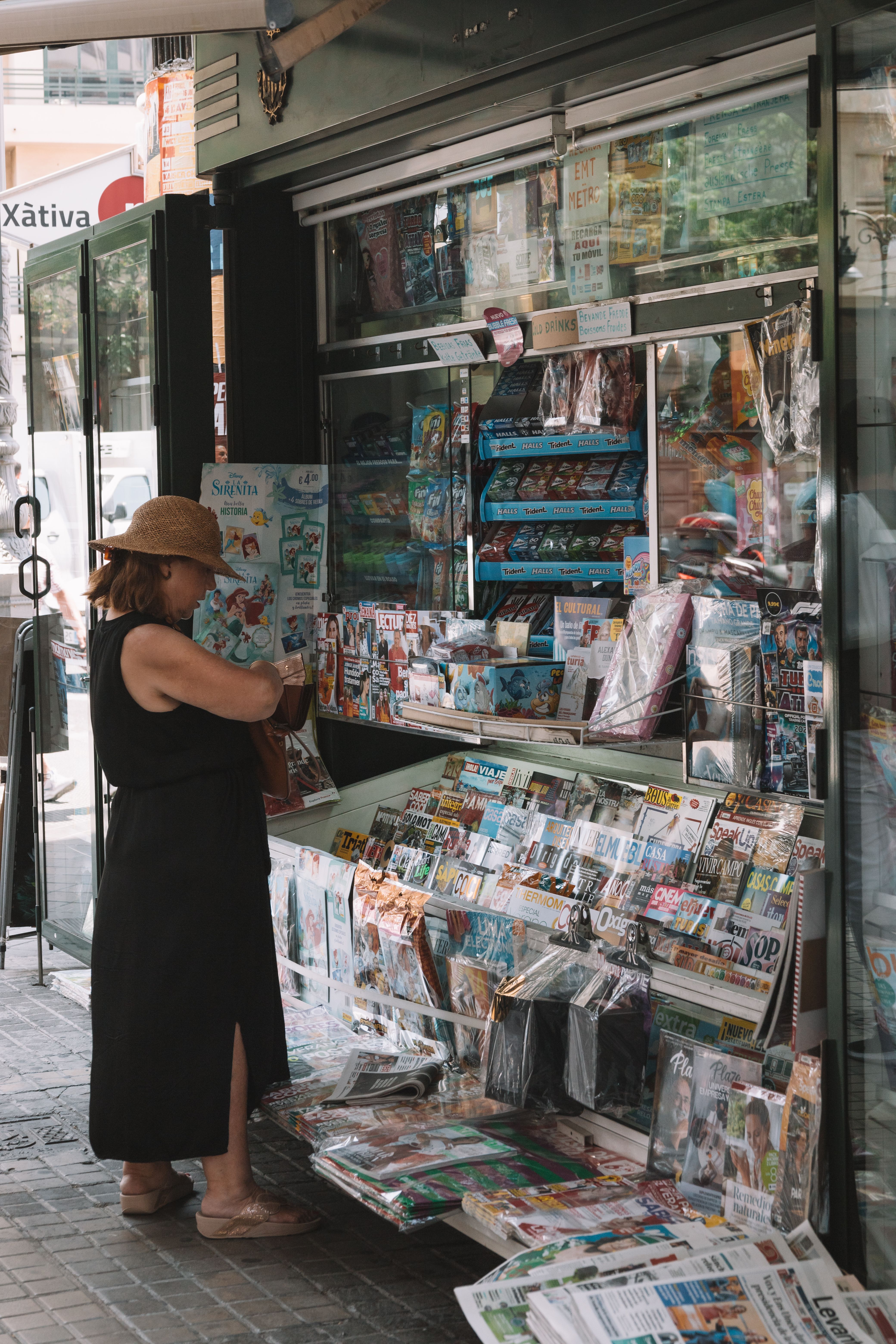 Woman in Front of Newsstand · Free Stock Photo